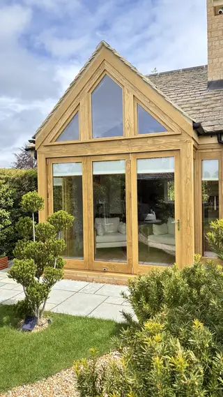 Front view of the Accoya-clad steel-framed extension with full-height glazed doors