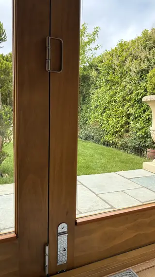 Glazed doors opening onto the stone terrace