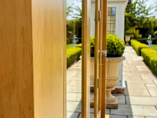 Close view along the oak door frame towards the terrace