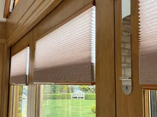 Pleated blinds fitted to oak-framed corner glazing